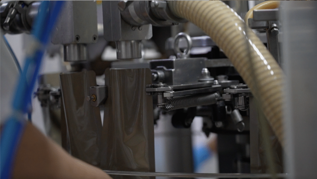 La Huerta de Oriente automatic industrial machine filling Meal Ready to Eat (MRE) packages in a food processing facility
